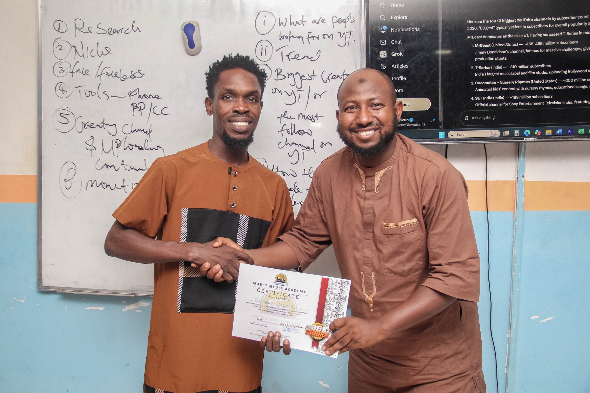 Mobet Media Academy participant receiving certificate