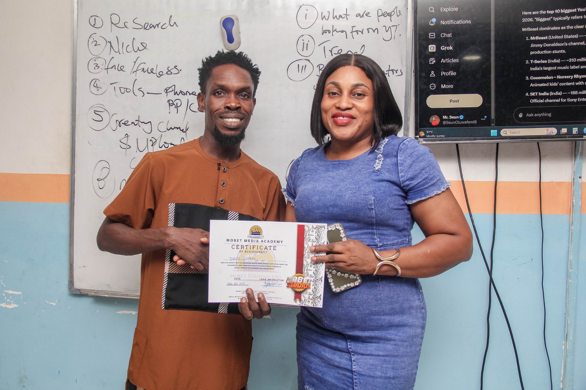 Mobet Media Academy participant receiving certificate