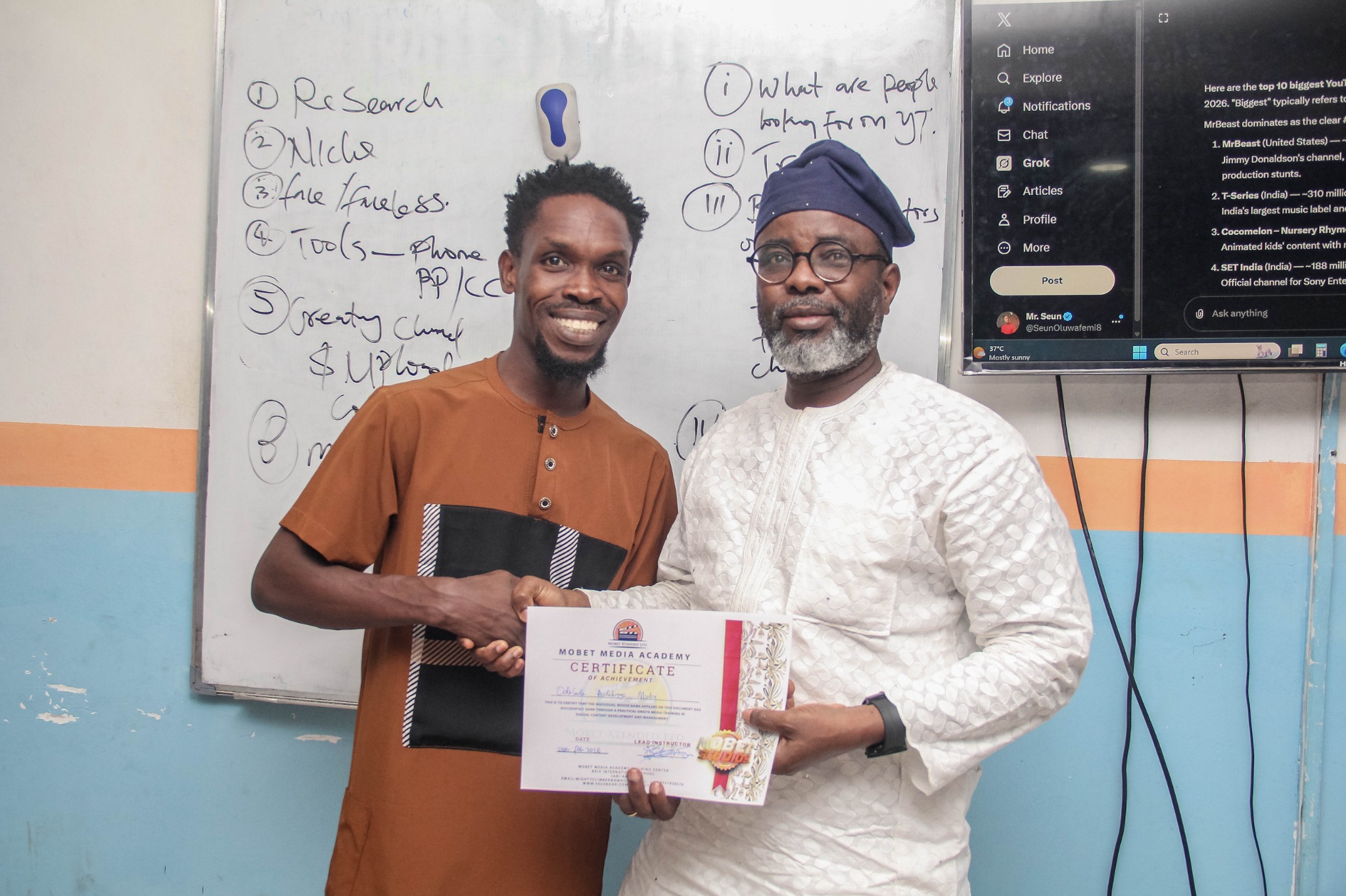 Mobet Media Academy participant receiving certificate
